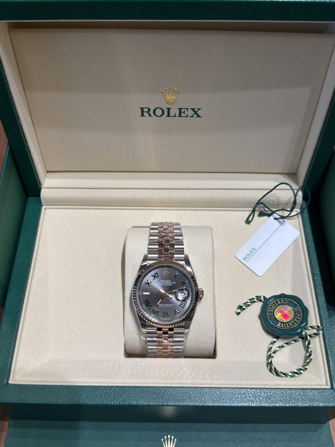 May be an image of wrist watch and text