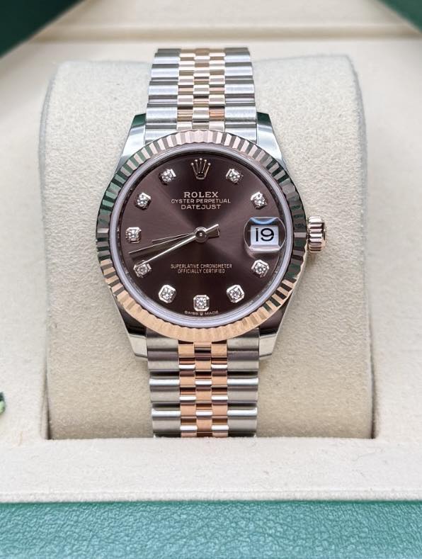 May be an image of wrist watch and text