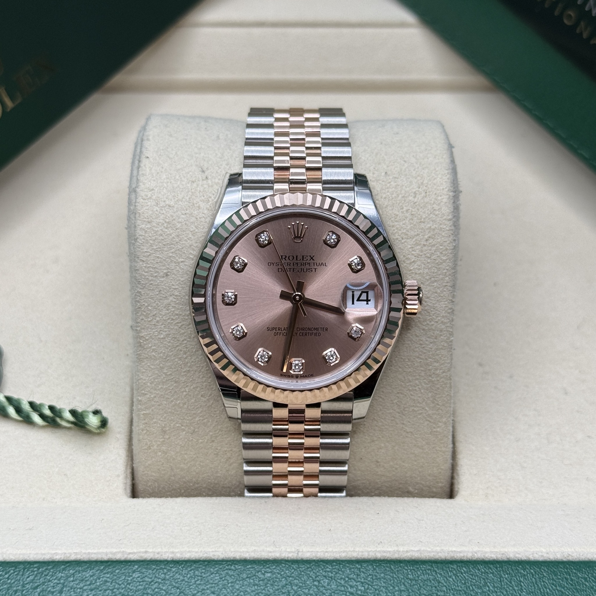 May be an image of wrist watch and text