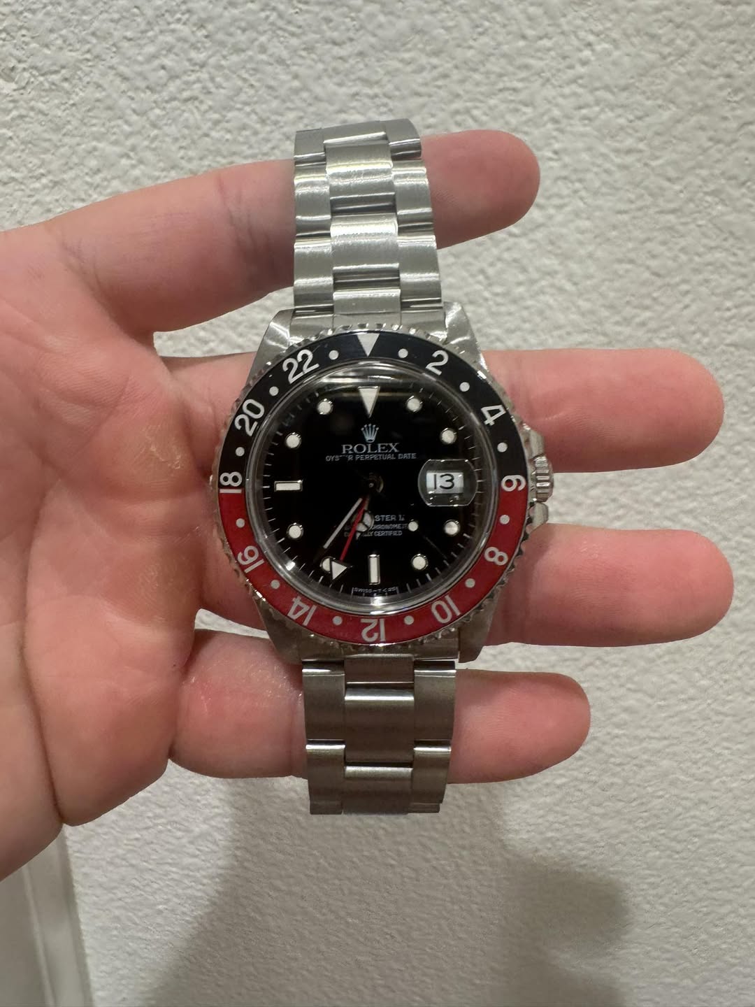 May be an image of wrist watch and text