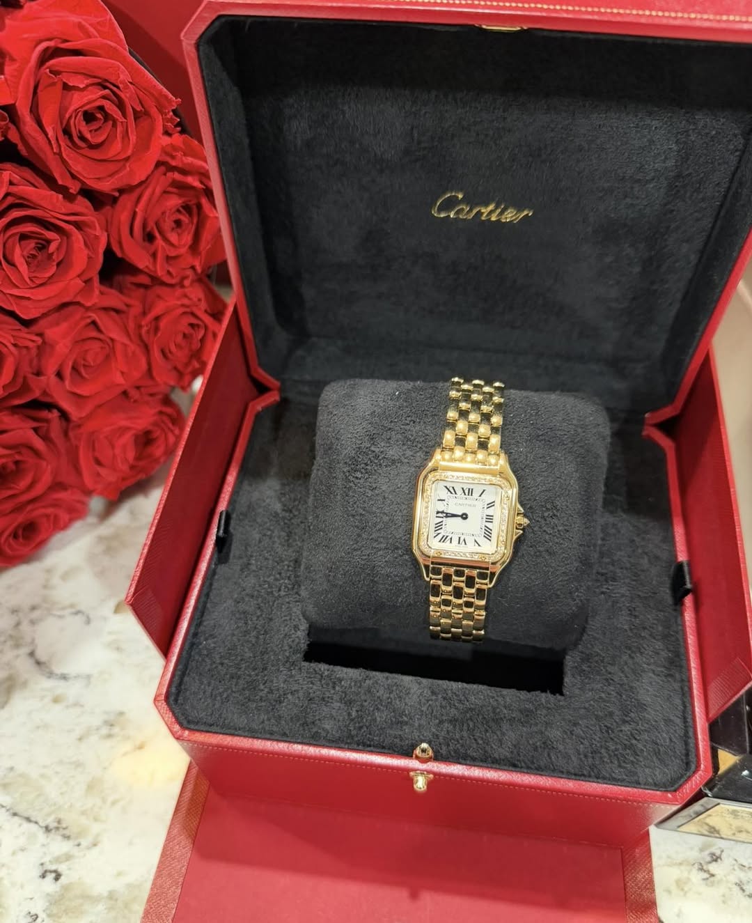 May be an image of wrist watch and text