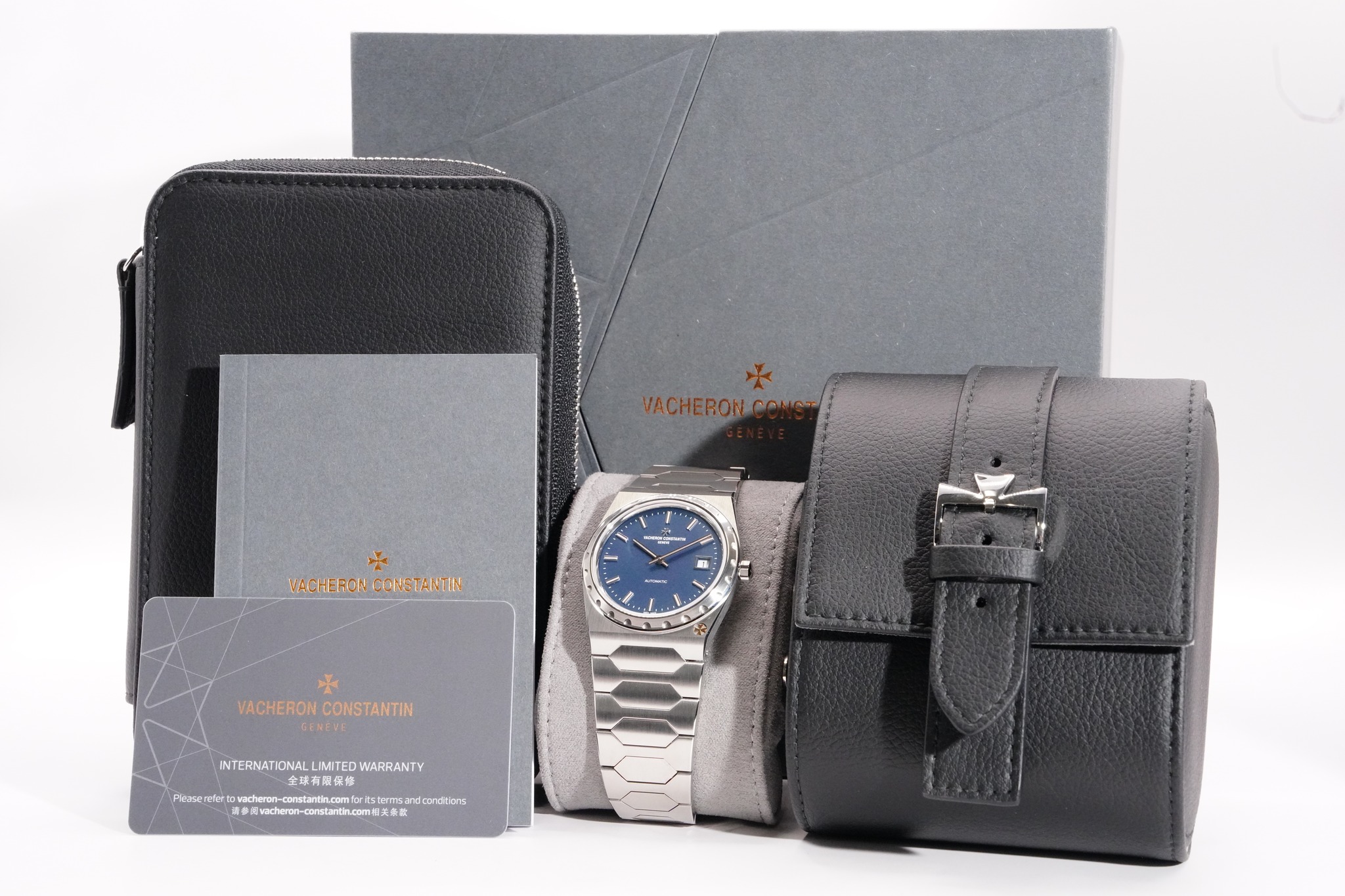 May be an image of leather wallet, saddle-stitched leather, wrist watch, leather and text