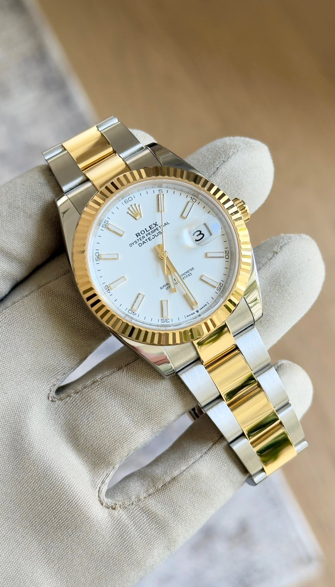 May be an image of wrist watch and text