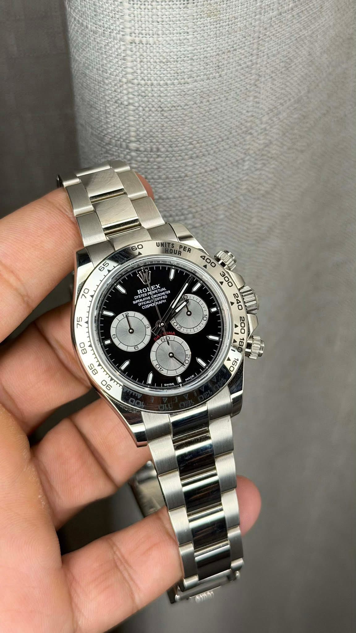 May be an image of wrist watch and text
