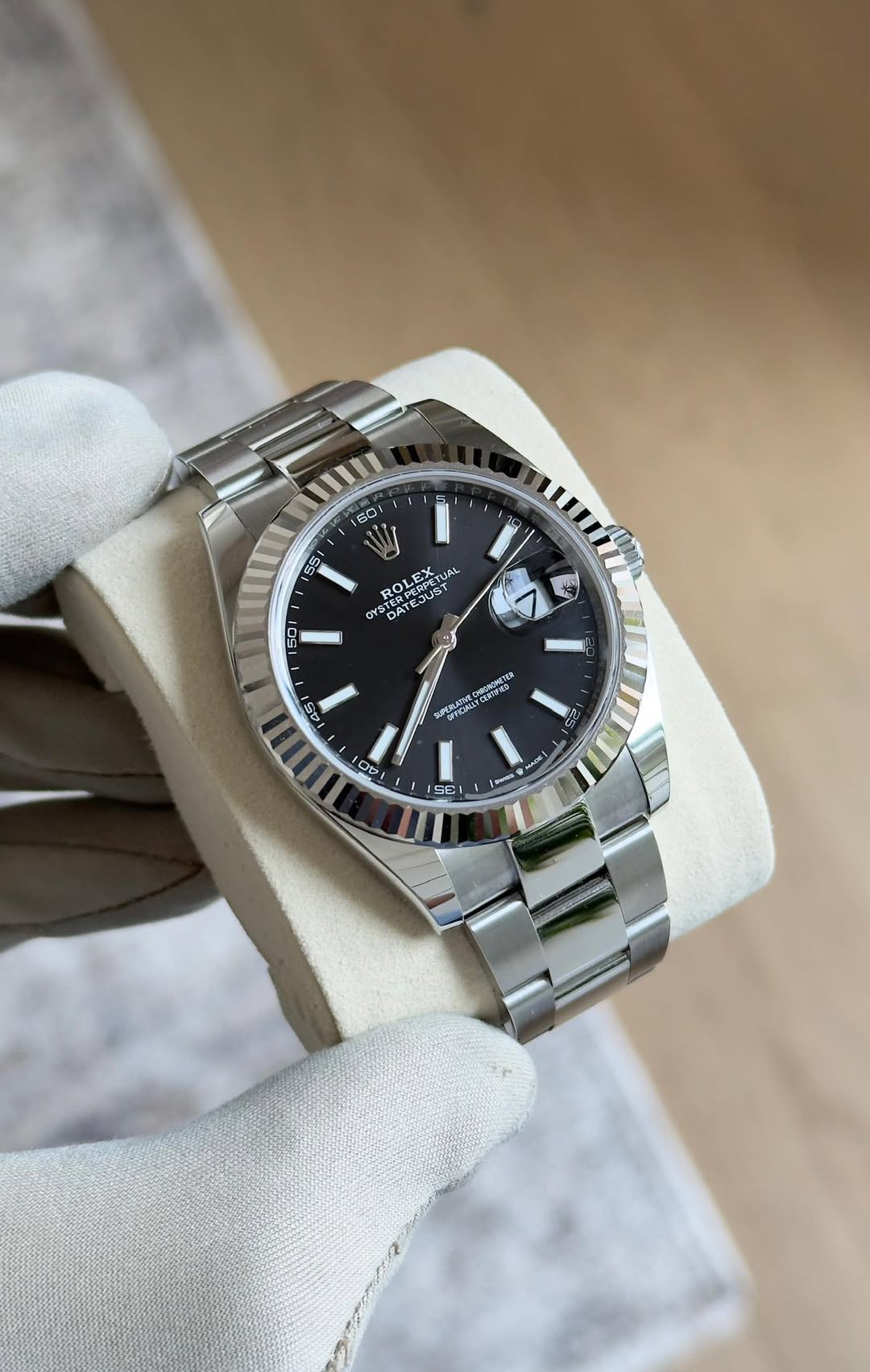 May be an image of wrist watch and text