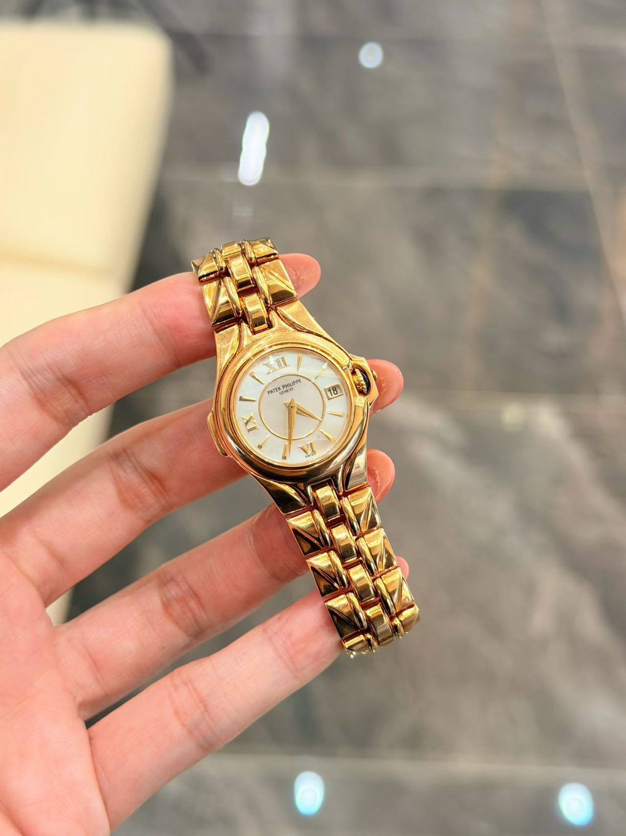 May be an image of wrist watch and text