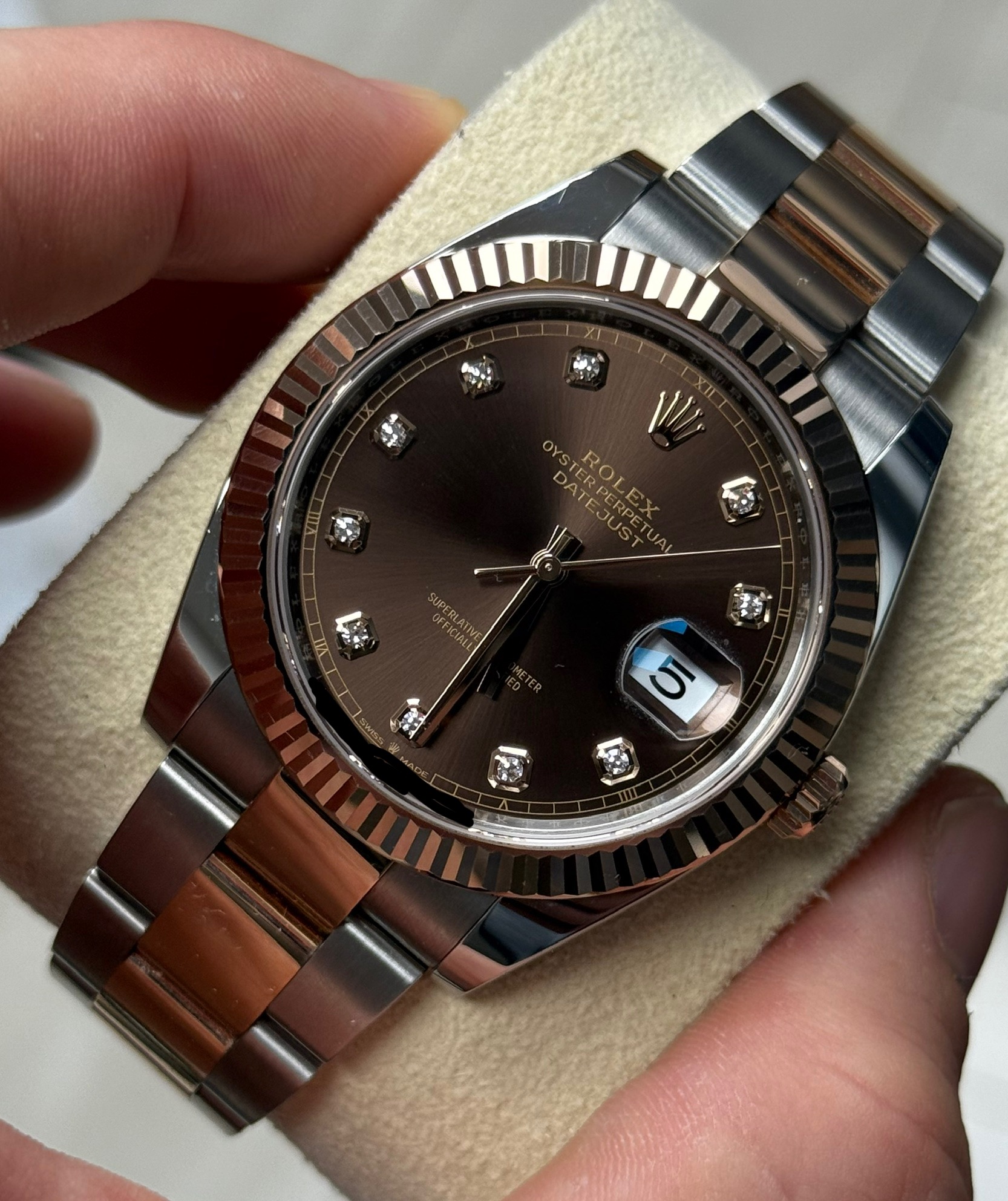 May be an image of wrist watch and text