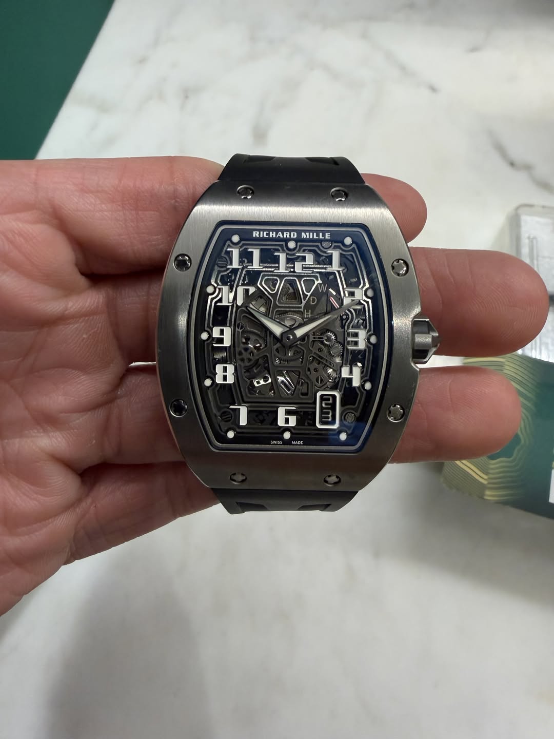 May be an image of wrist watch and text
