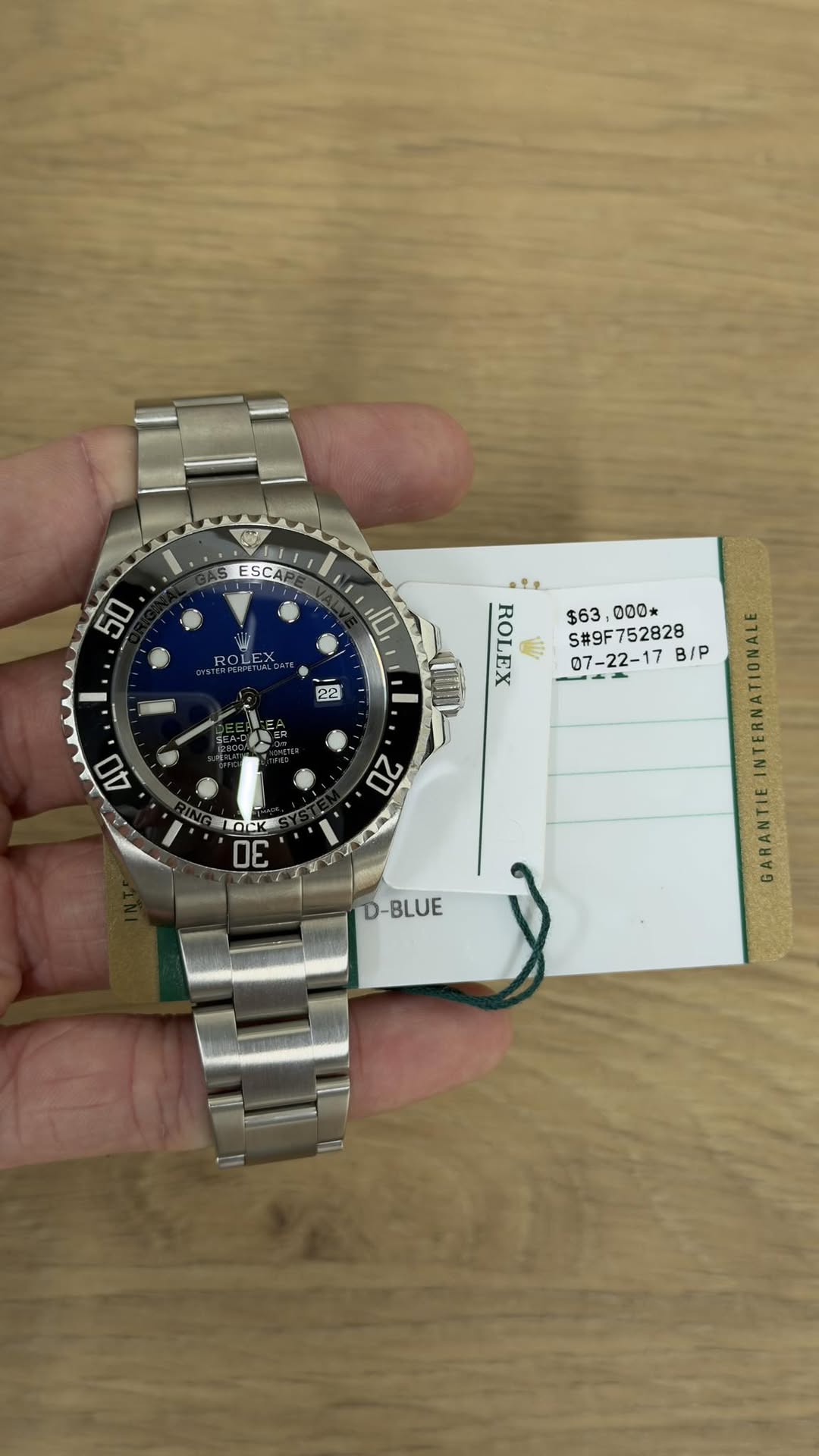 May be an image of wrist watch and text that says 'ESCA 50 ROLEX 10 22 $63, 000* ~ ROLEX #9F752828 07-22-17 B/P 4O 20 LOICK OE nS D-BLUE ARAN'