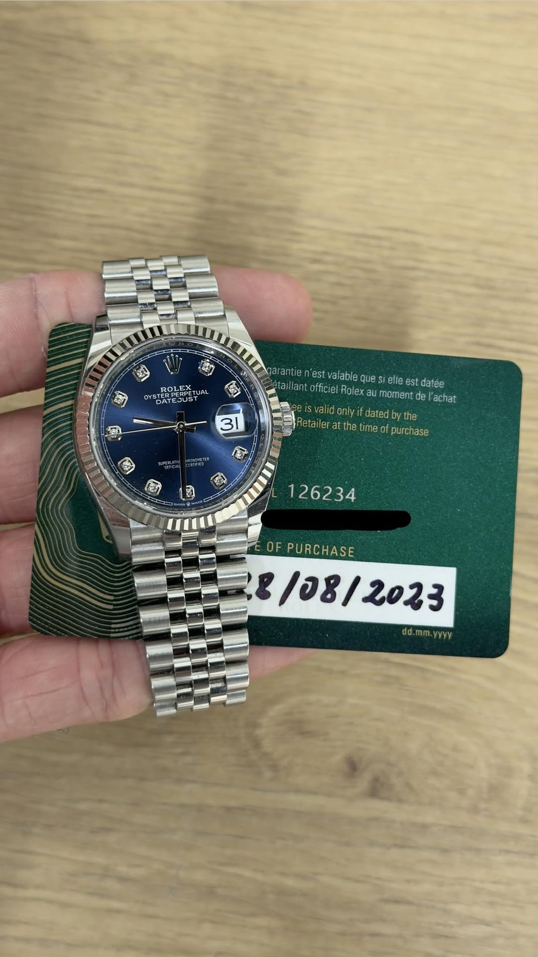 May be an image of wrist watch and text