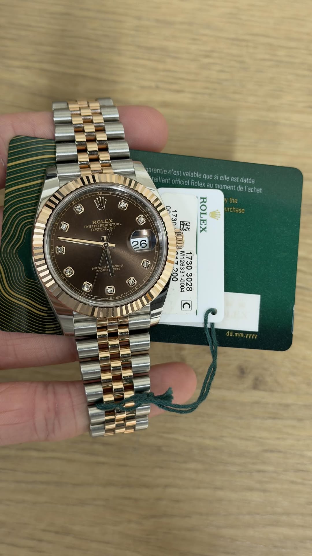 May be an image of wrist watch and text