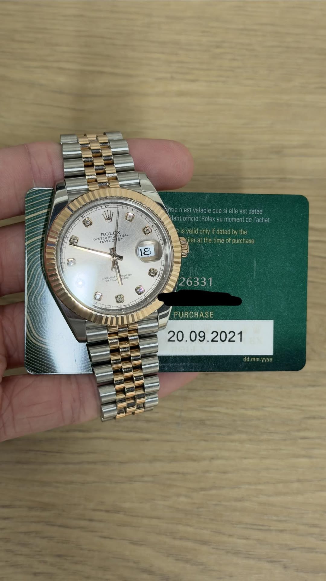 May be an image of wrist watch and text