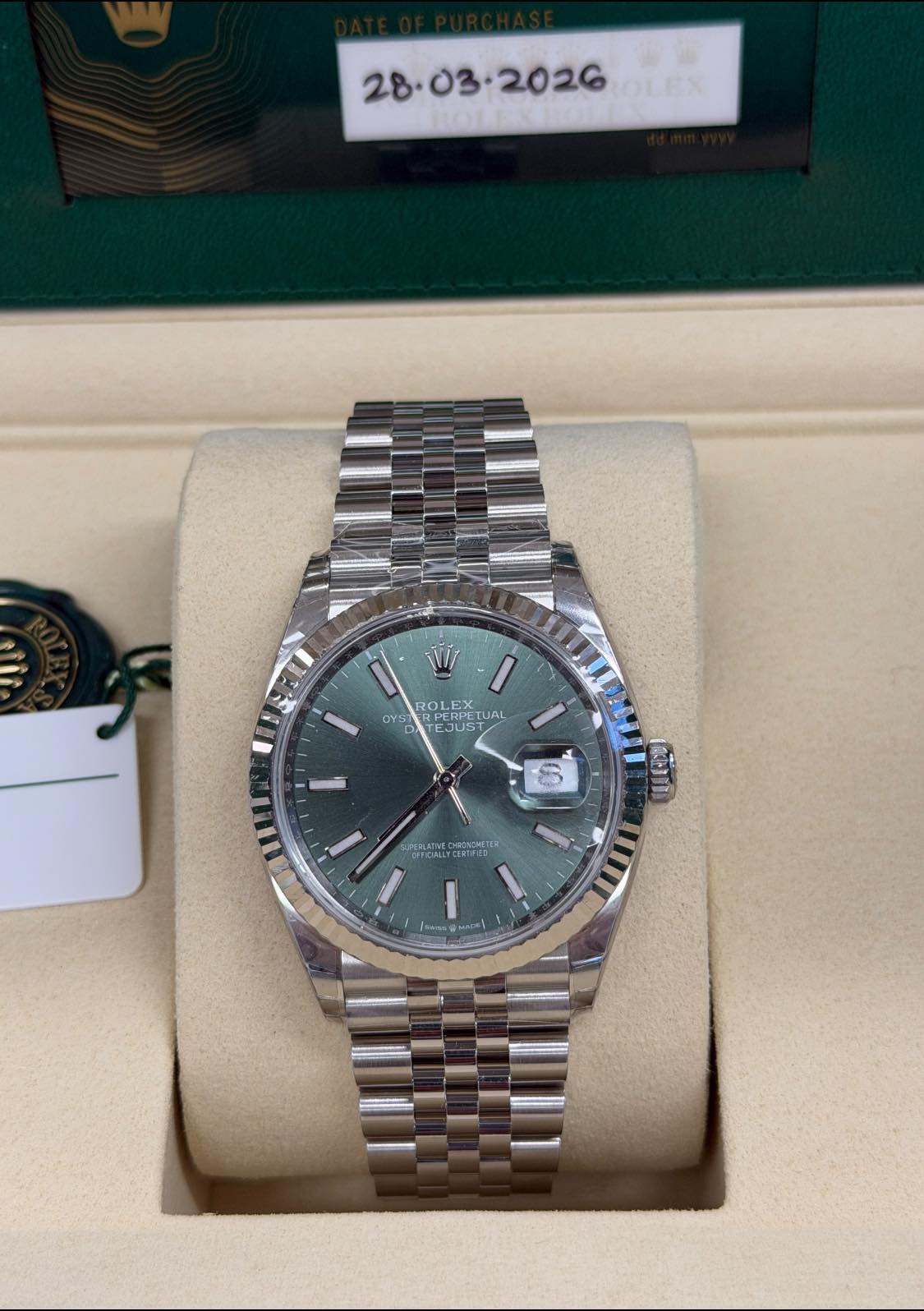 May be an image of wrist watch and text