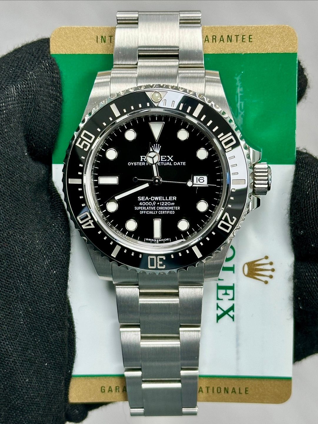 May be an image of wrist watch and text that says 'IN ARANTEE 50 REX R EX OYSTERPL PETUAL ETUAL DATE 10 16 SEA- SEA-DWELLER ・4000 4000A 4000/t.1220m ·1220m ንረ20 SUPERLATI CHR…