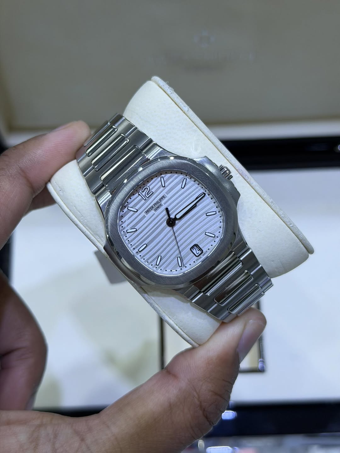May be an image of wrist watch and text