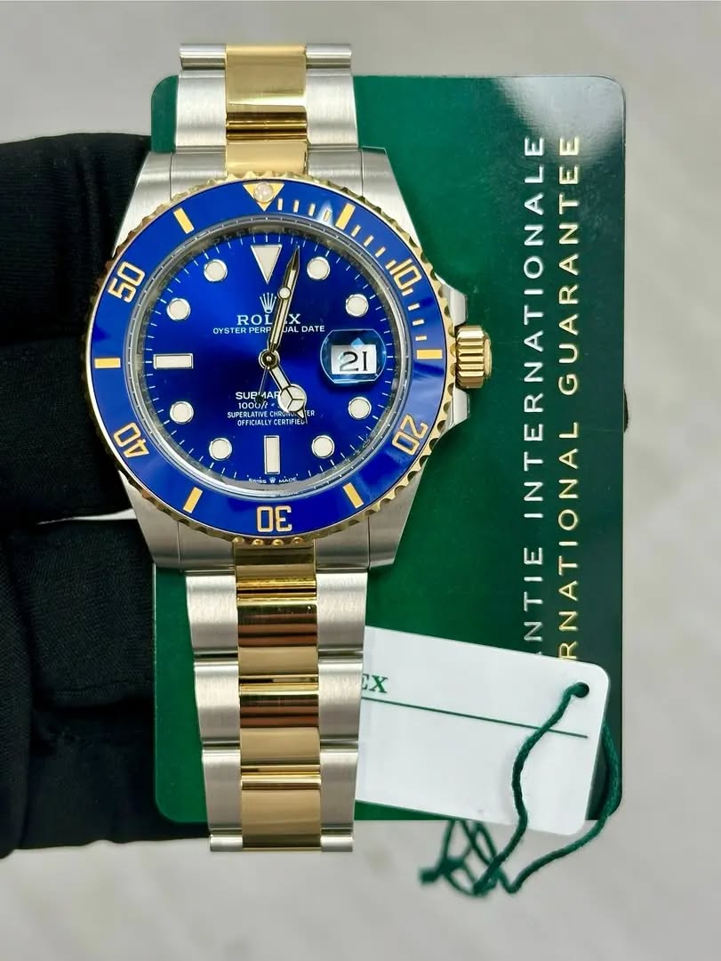 May be an image of wrist watch and text that says '50 ROL X OYSTERP PJAL DATE 21 SUP SUPMAR MAR LAN CORTIFIES ER OFFICIALLY NTERNATIONALE RNATIONA INTERNA IONALGUARANTEE NTIE…