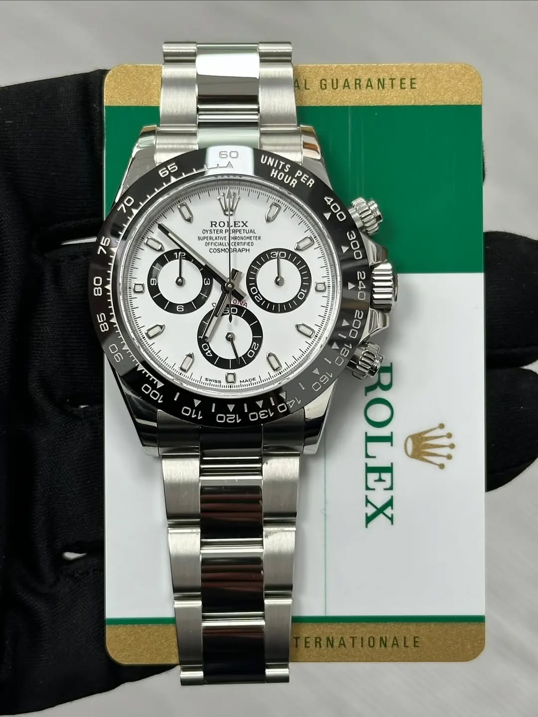 May be an image of wrist watch and text that says 'L GUARANTEE 60 LA 65 70 UNITS HOUR PER ROLEX OYSTERP Priless ERPETUAL NSMESED BEFICIALLY CERTIFIED COSMOGRAPH 0 12 30 ወ 80 ผ 6…