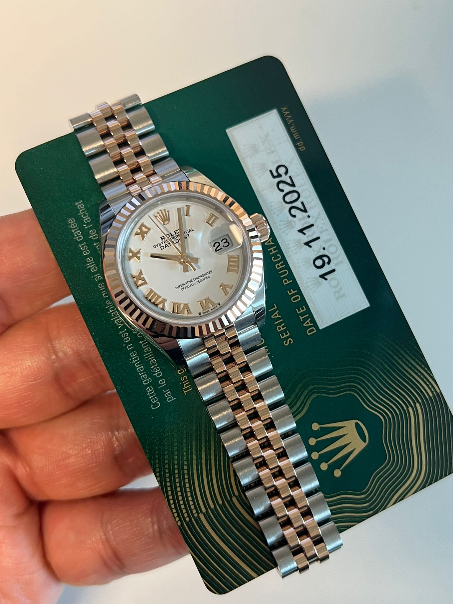 May be an image of wrist watch and text