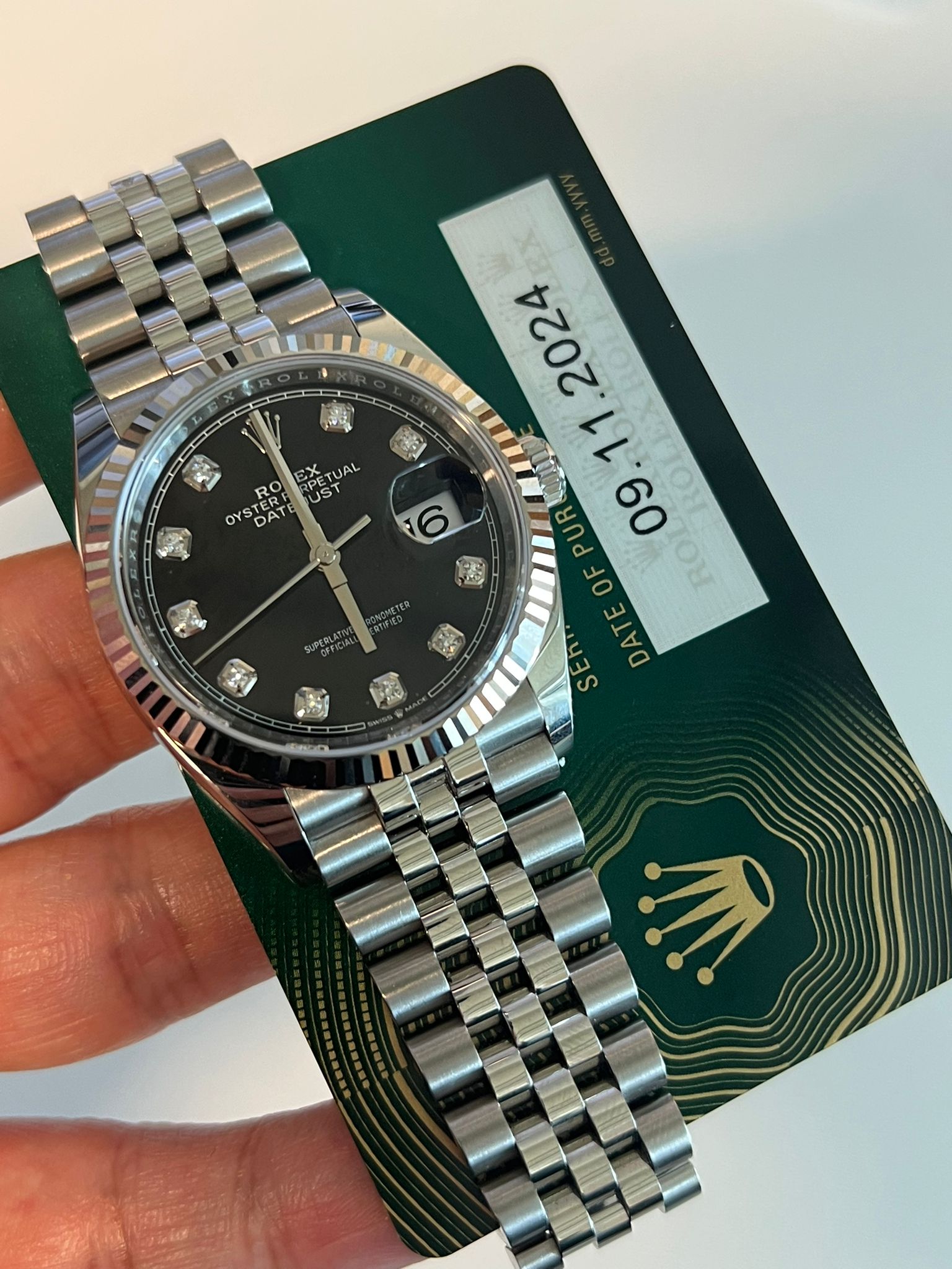 May be an image of wrist watch and text that says 'SX UAL OYSTERE コス RPET 早に US RO OYS 一0T DATE BA TERF RO 6 ፍርያ 2024 11 PUR 人 09 0 RO E DAT D A S'