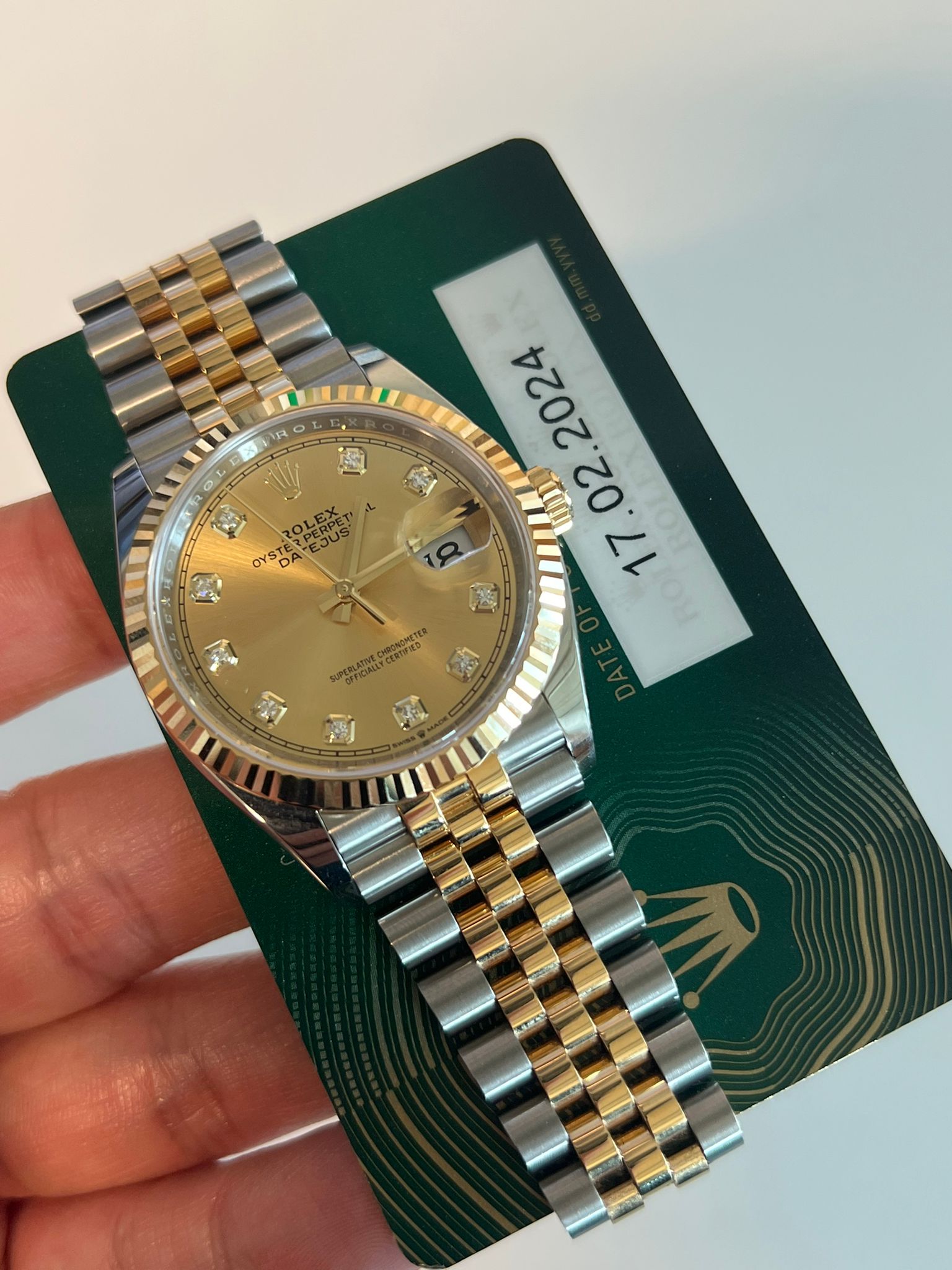 May be an image of wrist watch and text