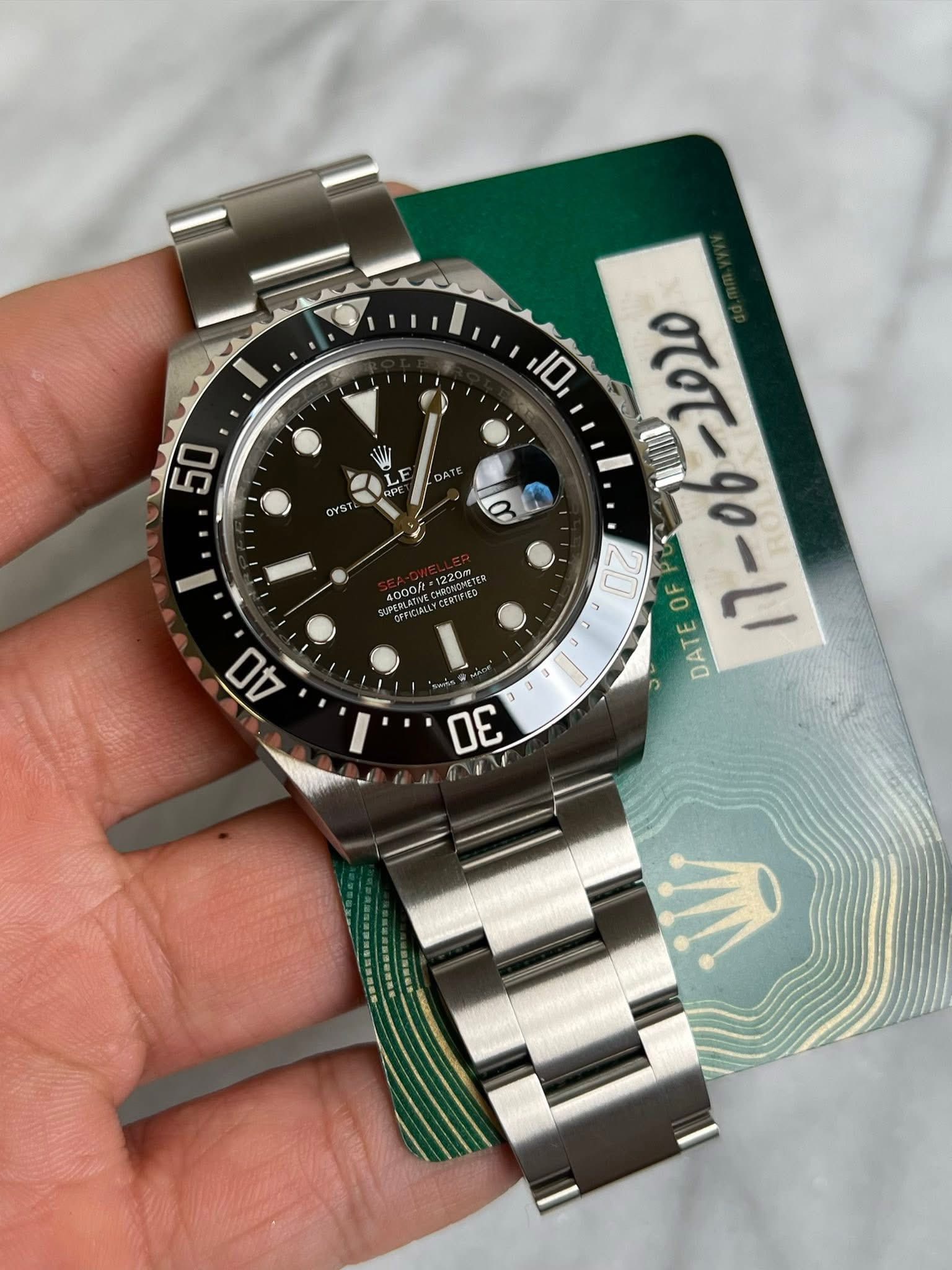 May be an image of wrist watch and text