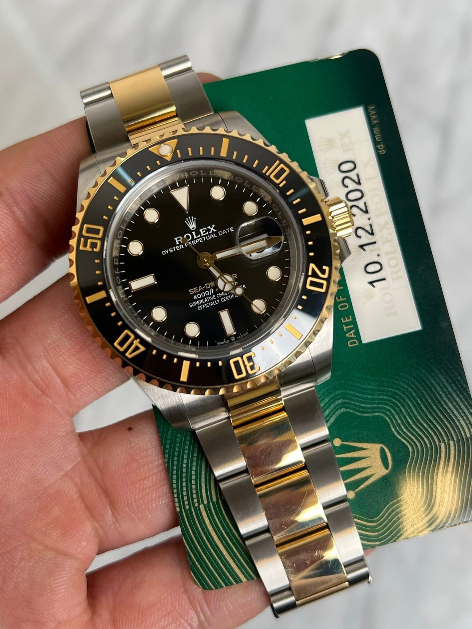 May be an image of wrist watch and text that says '10 50 ROLEX RPETUALD EX DATE OYSTER 4000/t PEBAPIALLYCERT . OF DATEO DAT 30'