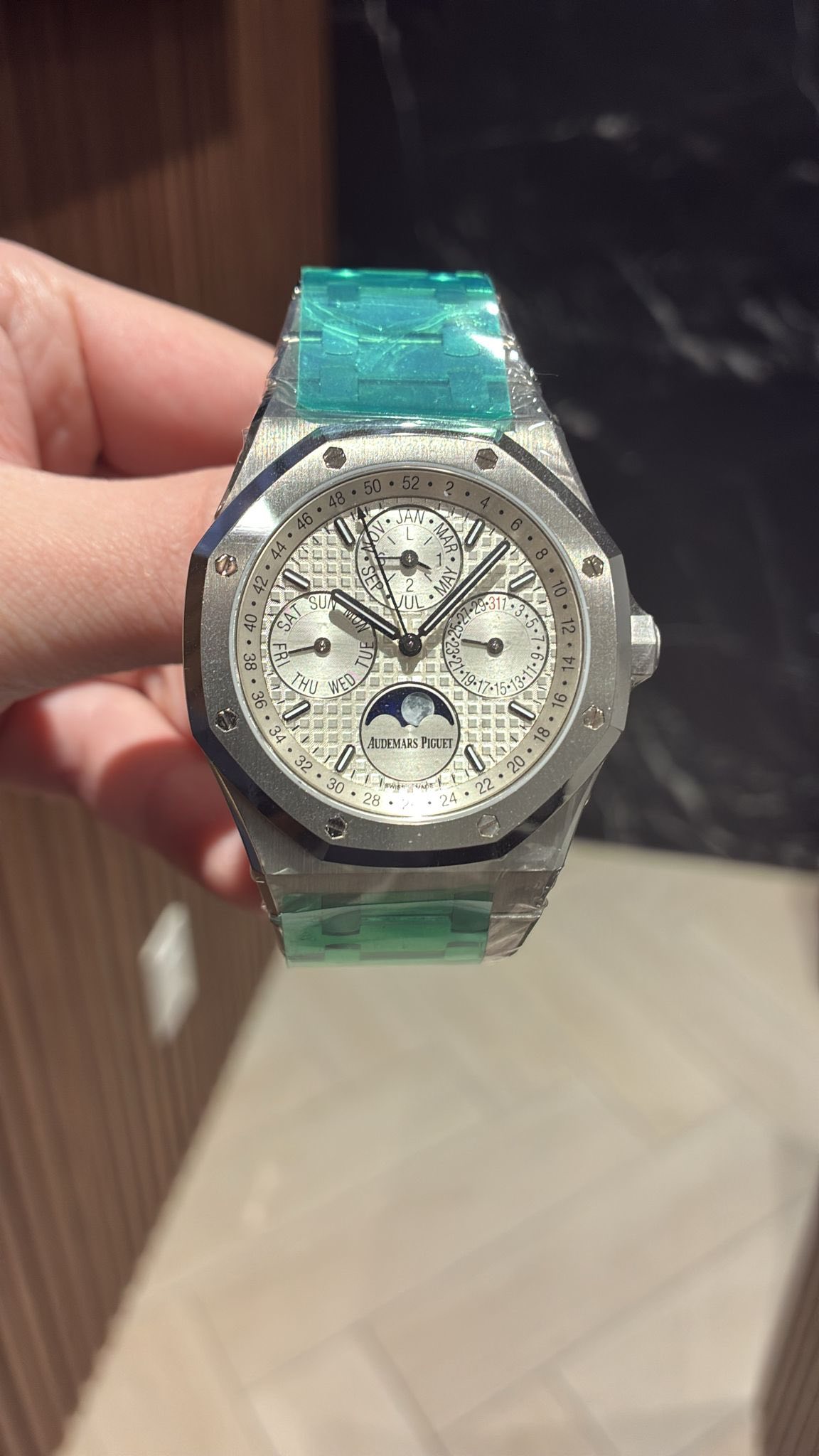 May be an image of wrist watch and text
