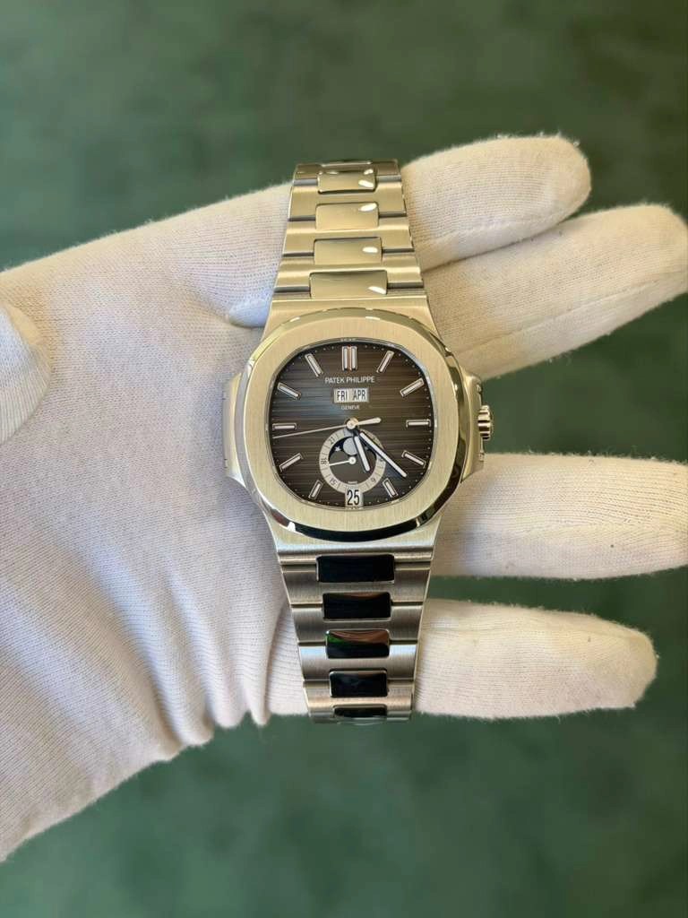 May be an image of wrist watch and text that says 'PATEK ILIPPE FRIAPE AP3 DENTIA ন্া ዜ 25'
