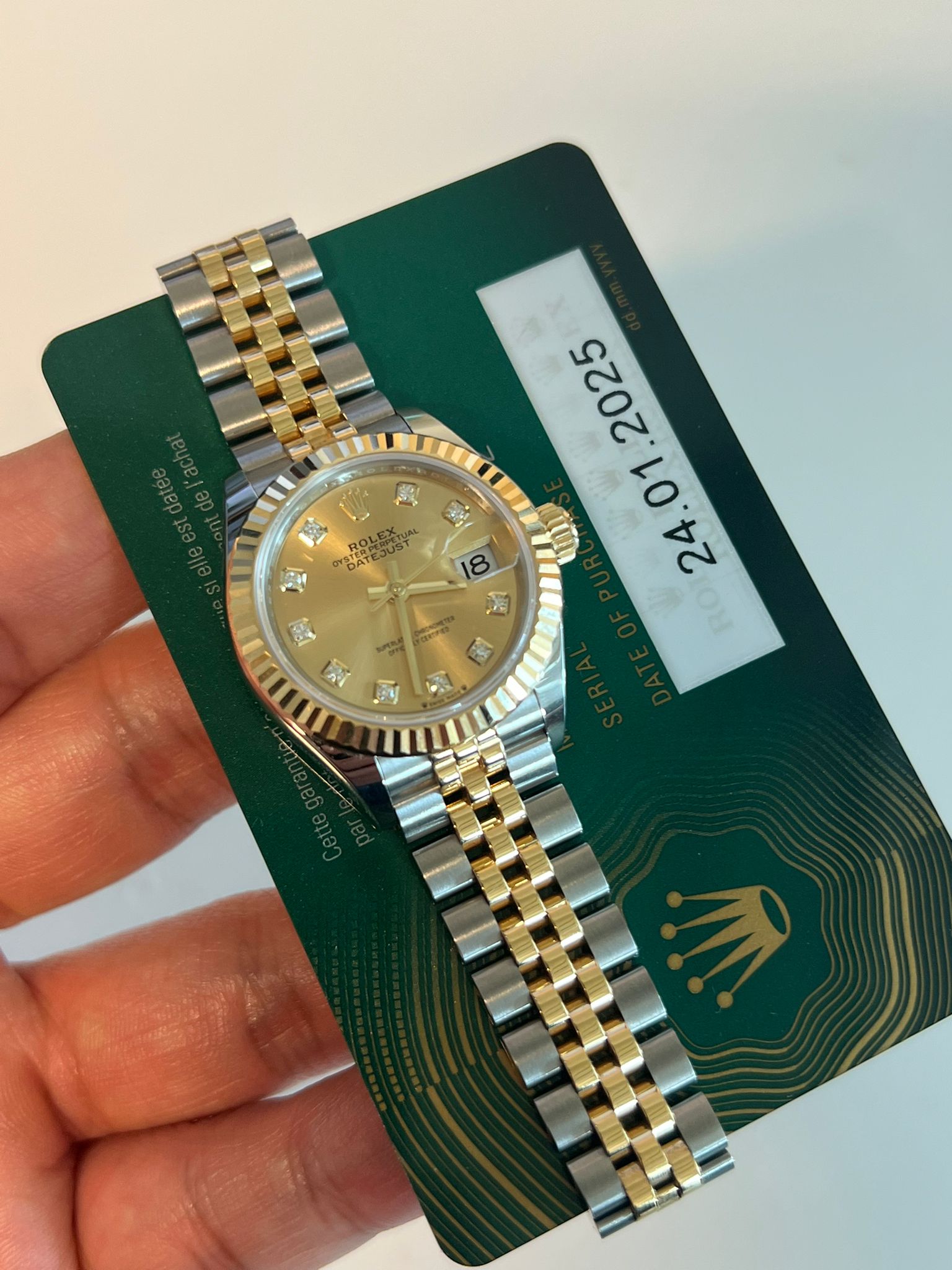 May be an image of wrist watch and text