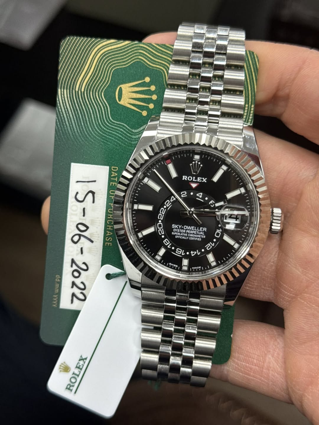 May be an image of wrist watch and text