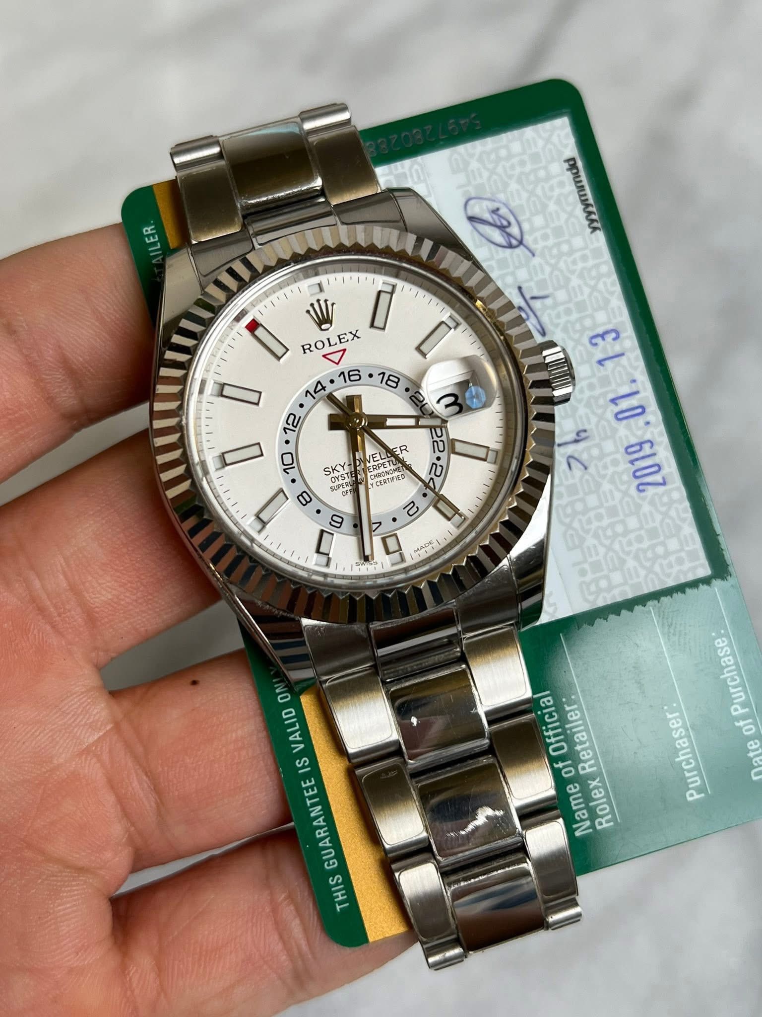 May be an image of wrist watch and text that says 'にこ W I R ROLEX יויוי ل + ល b2 2 SKY ዓ SUPERU 10 1 E 10 6007 g HIONOHE はれカが変多 CER טח 9 없없: 9 ON VALID IS GUARANTEE THIS…