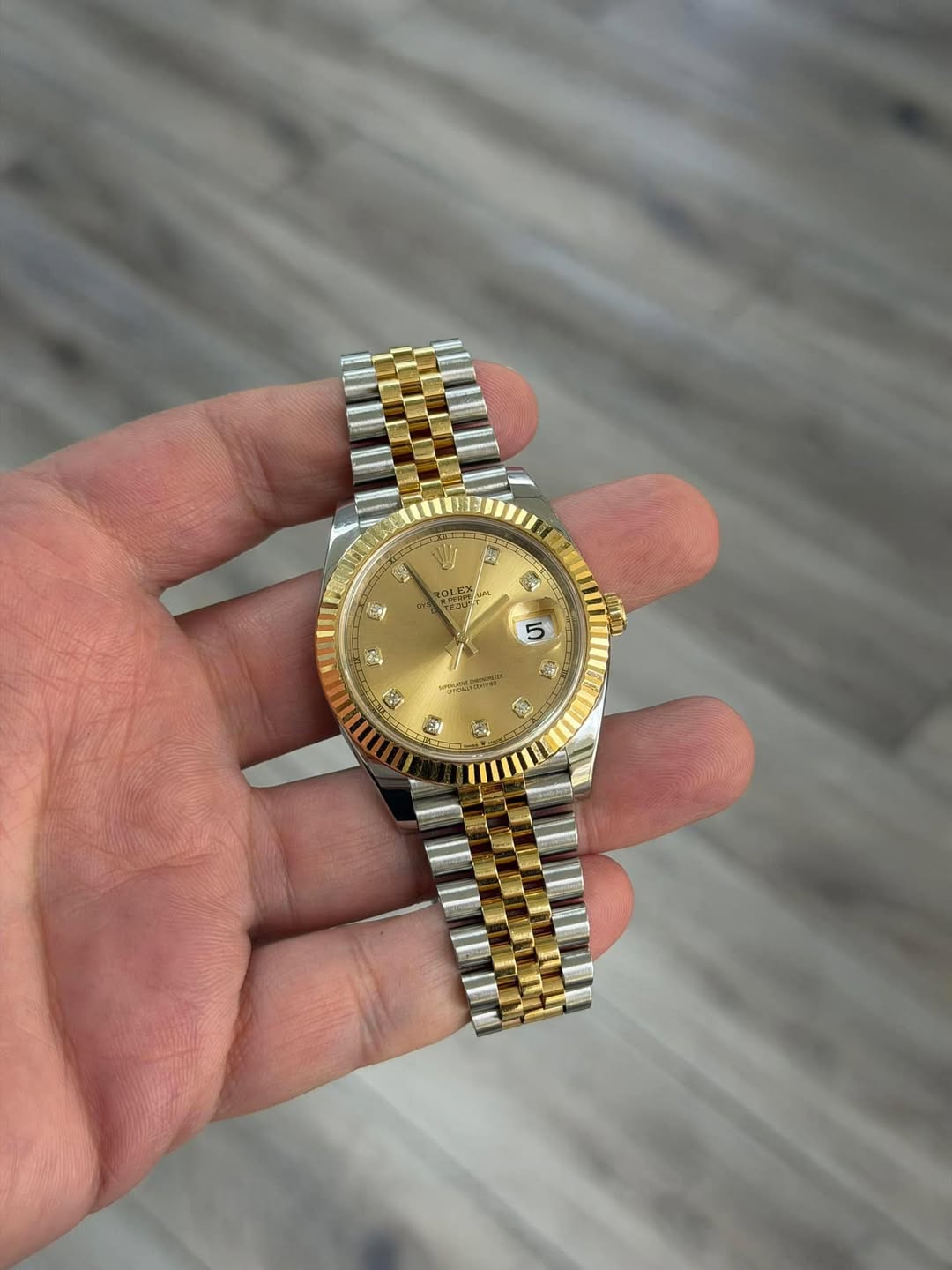 May be an image of wrist watch and text
