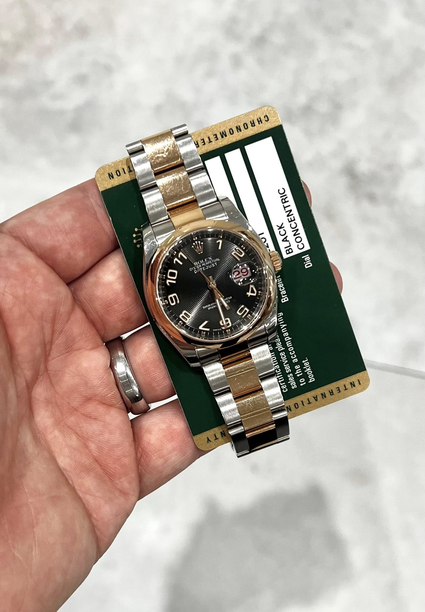 May be an image of wrist watch and text