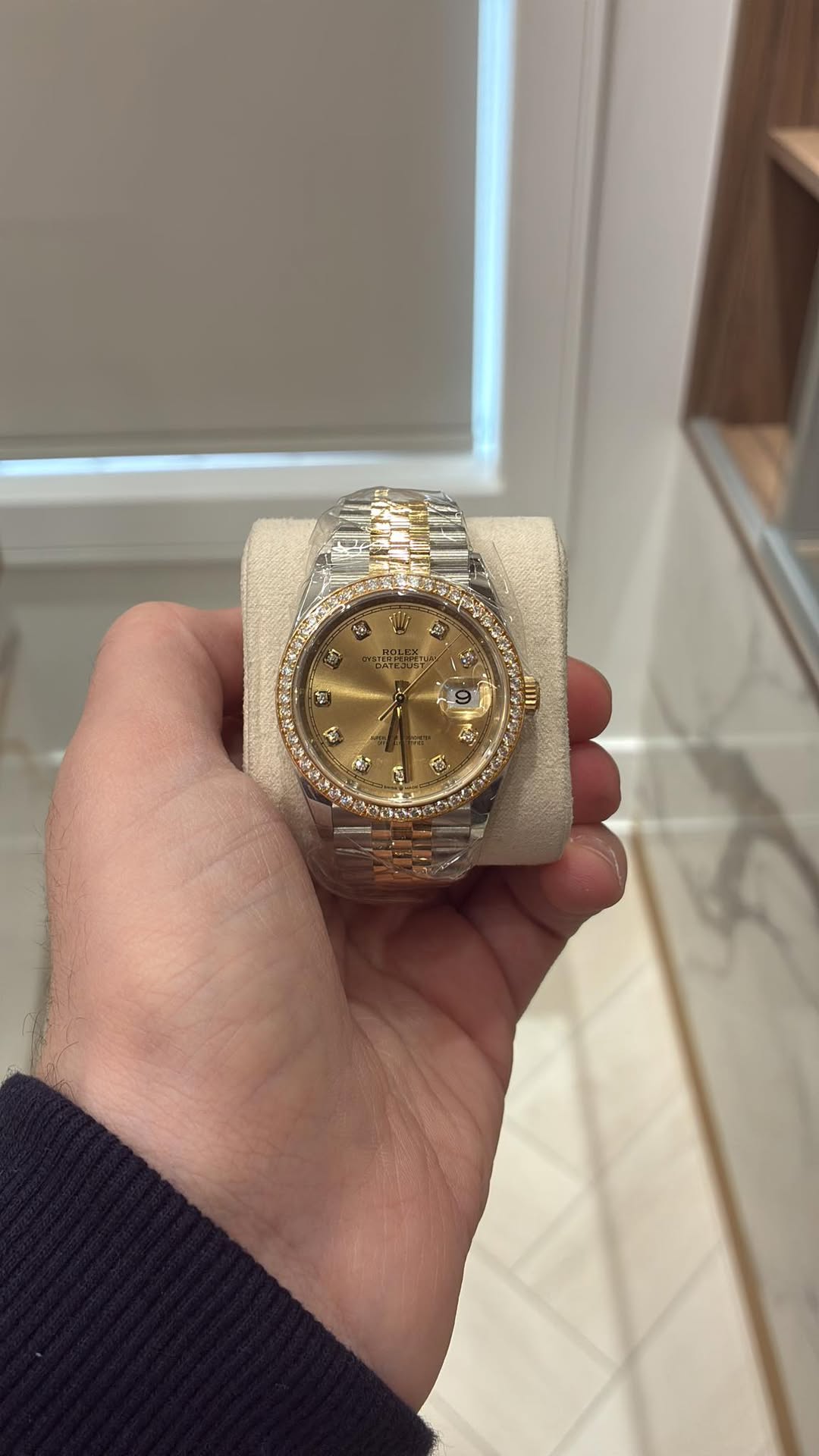 May be an image of wrist watch and text