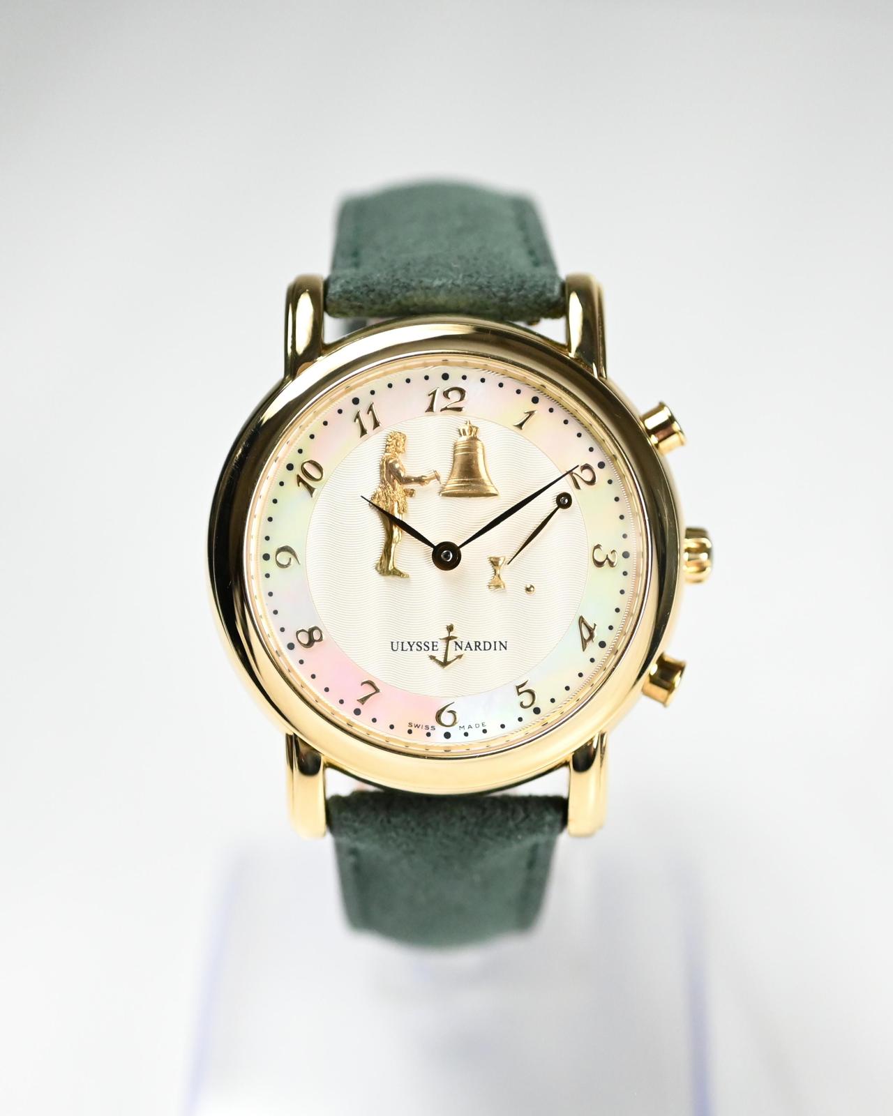 May be an image of wrist watch, jewelry and text that says ' Cí .00 "ፕለ ULYSSE ULYSSETNARDIN ULYSSETNARDIN NARDIN > 5 ل 6'