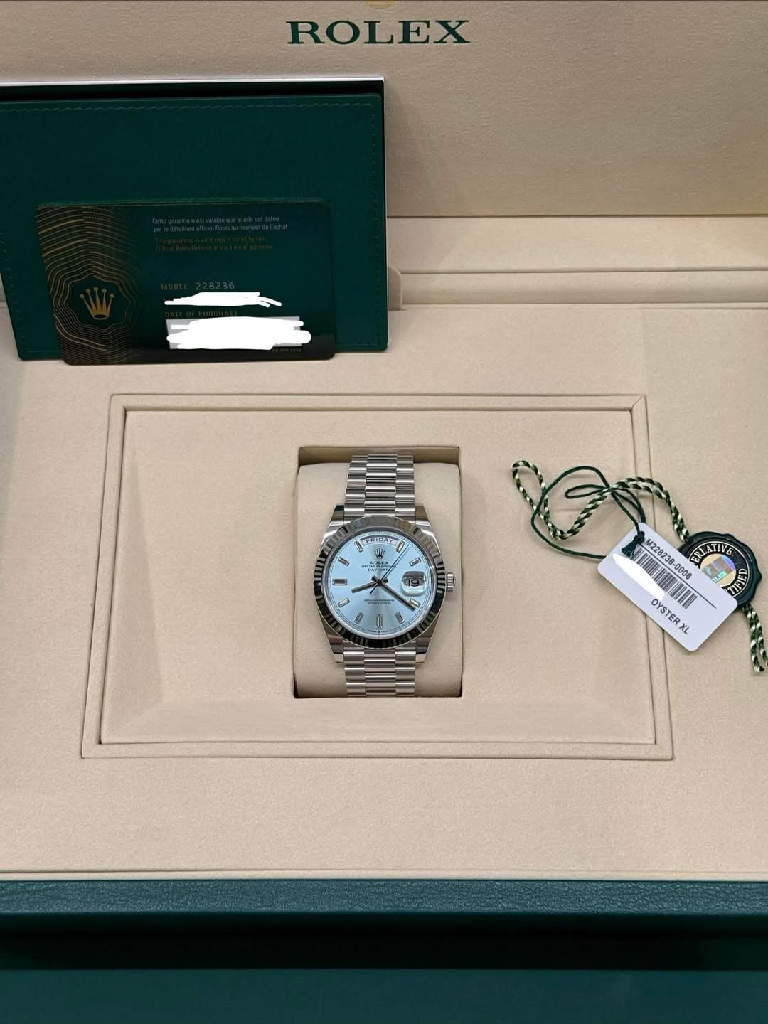 May be an image of wrist watch and text that says 'ROLEX CI- i4a ዓራራ ) Gia - - JA 团 M228238-0006 RLATIVE TIFED OYSTERXL OYS OYSTE TER RX XL'