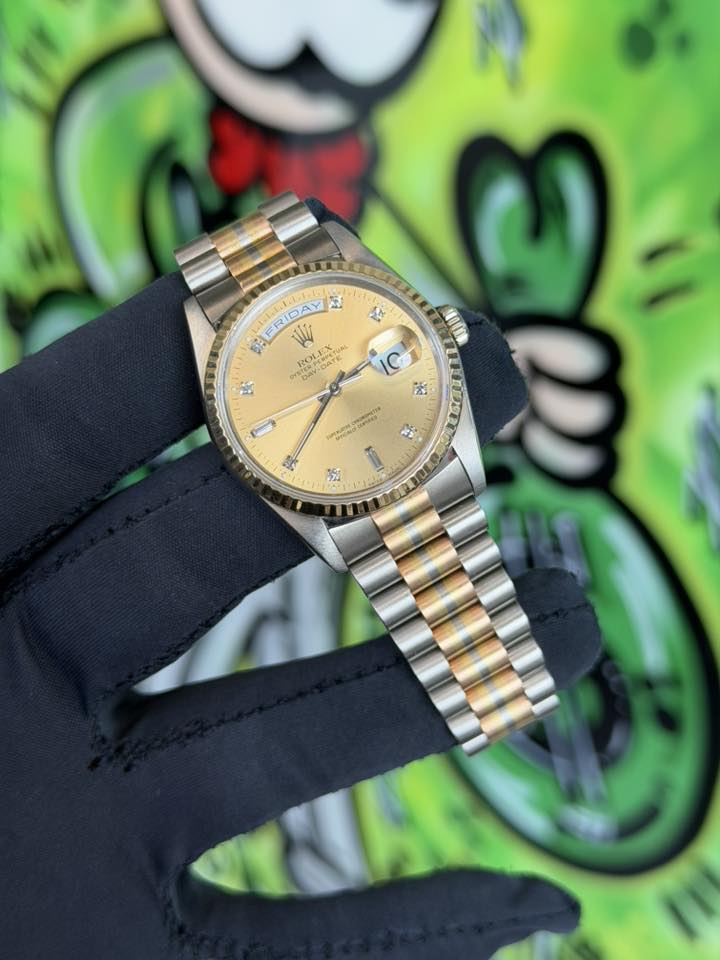 May be an image of wrist watch and text