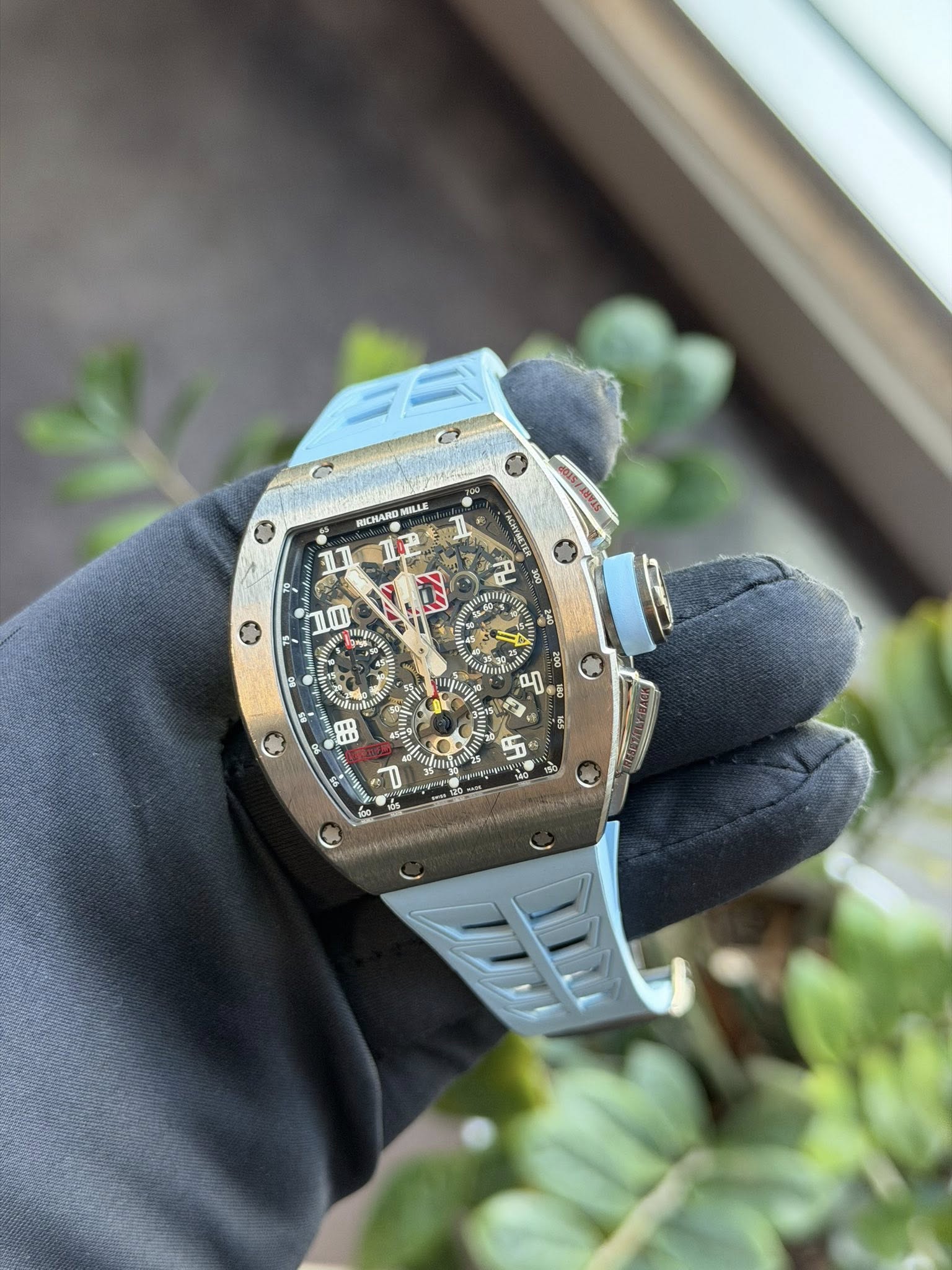 May be an image of wrist watch and text
