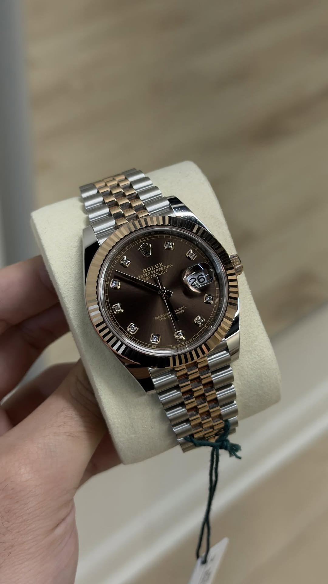 May be an image of wrist watch and text
