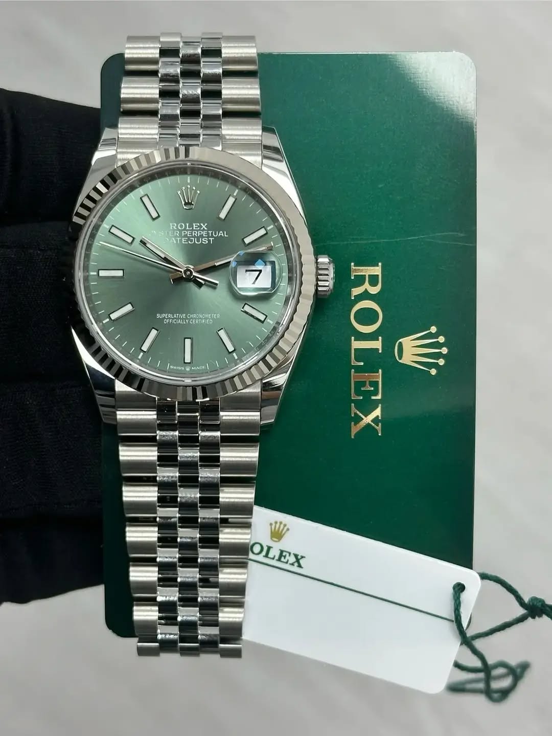 May be an image of wrist watch and text