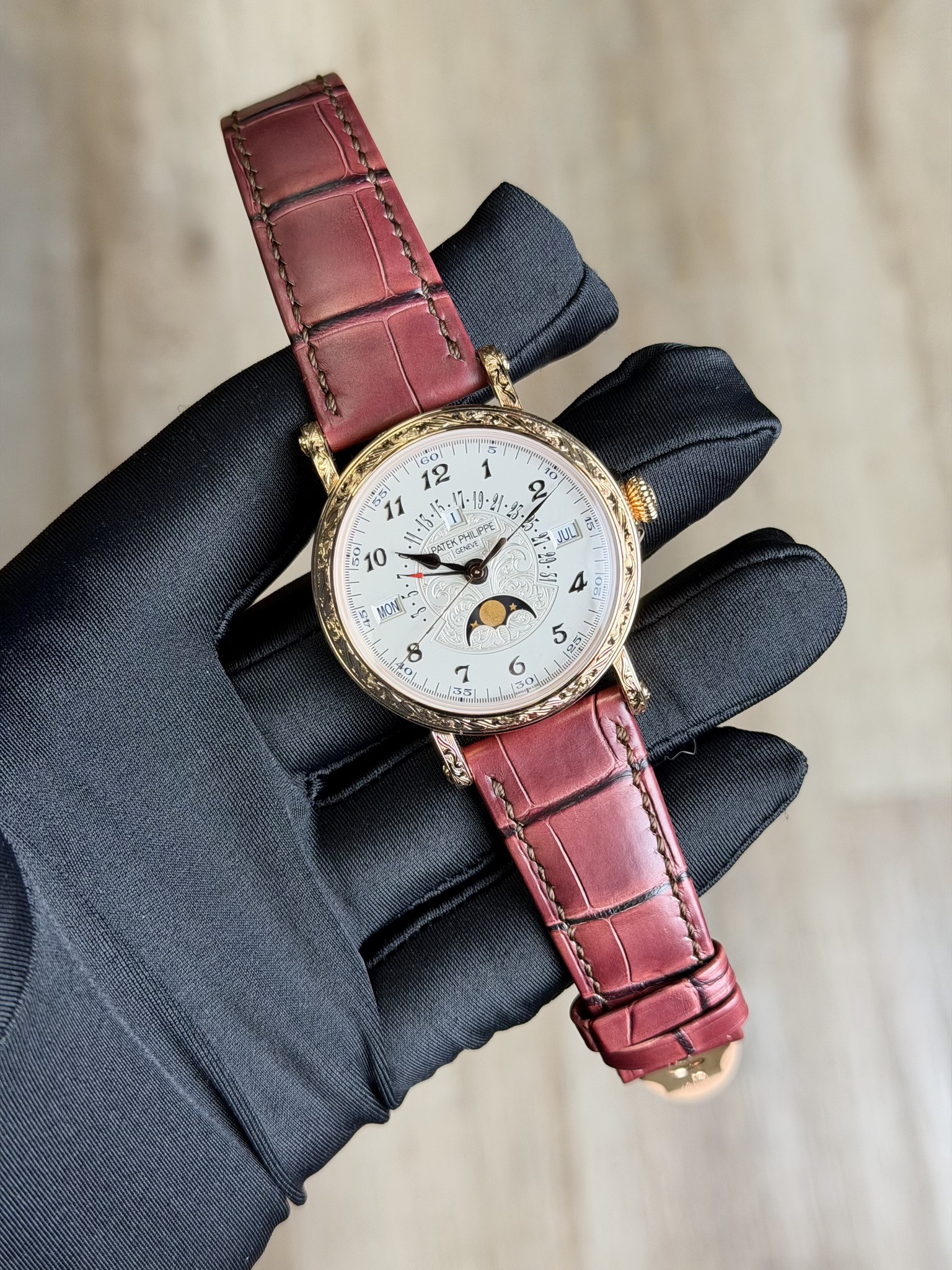 May be an image of wrist watch, leather and text