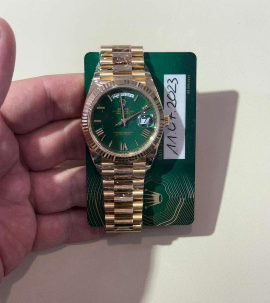 May be an image of wrist watch and text