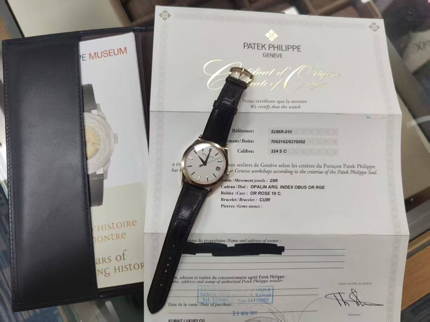 May be an image of wrist watch and text