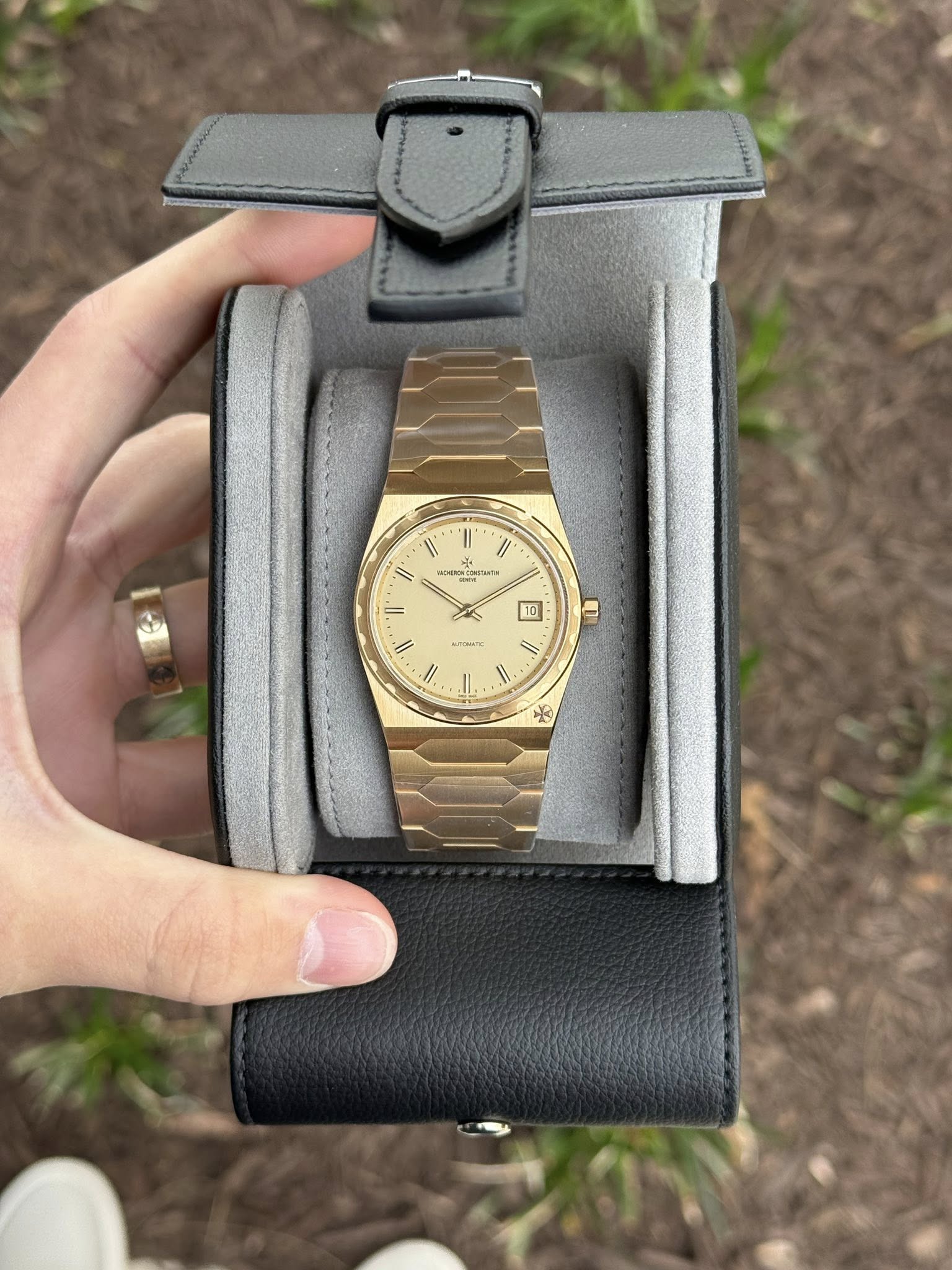 May be an image of wrist watch and text