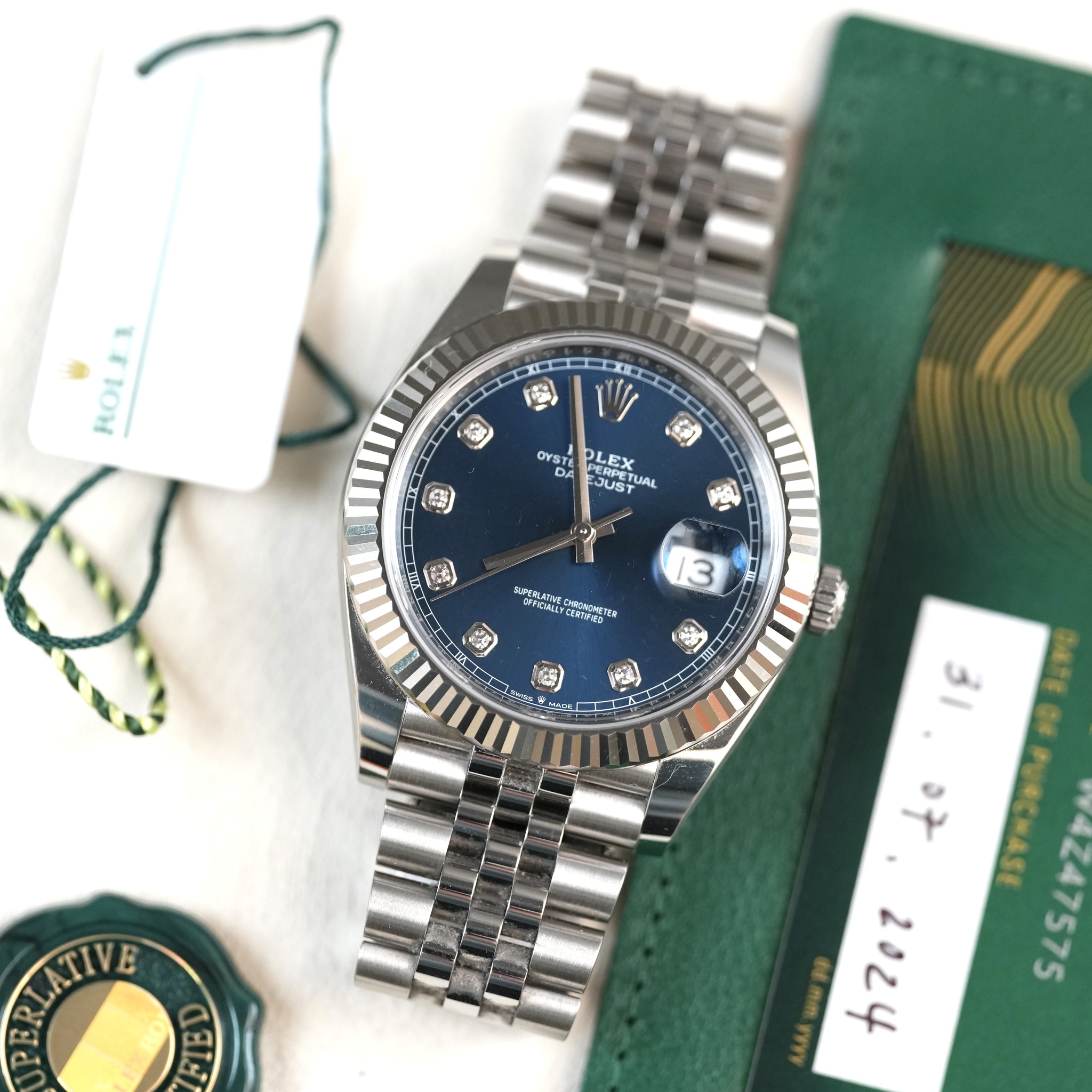 May be an image of wrist watch and text