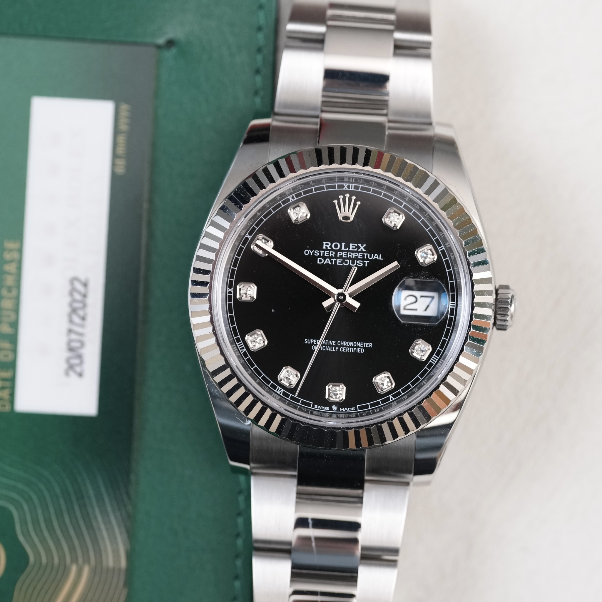May be an image of wrist watch and text