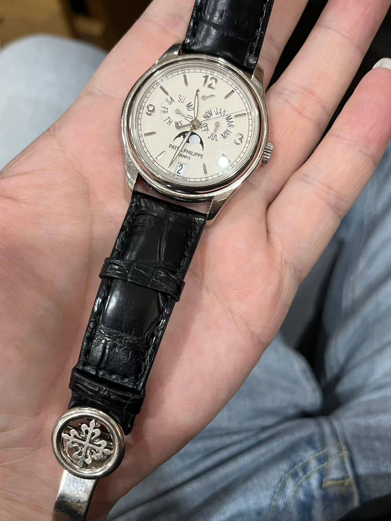 May be an image of wrist watch and text