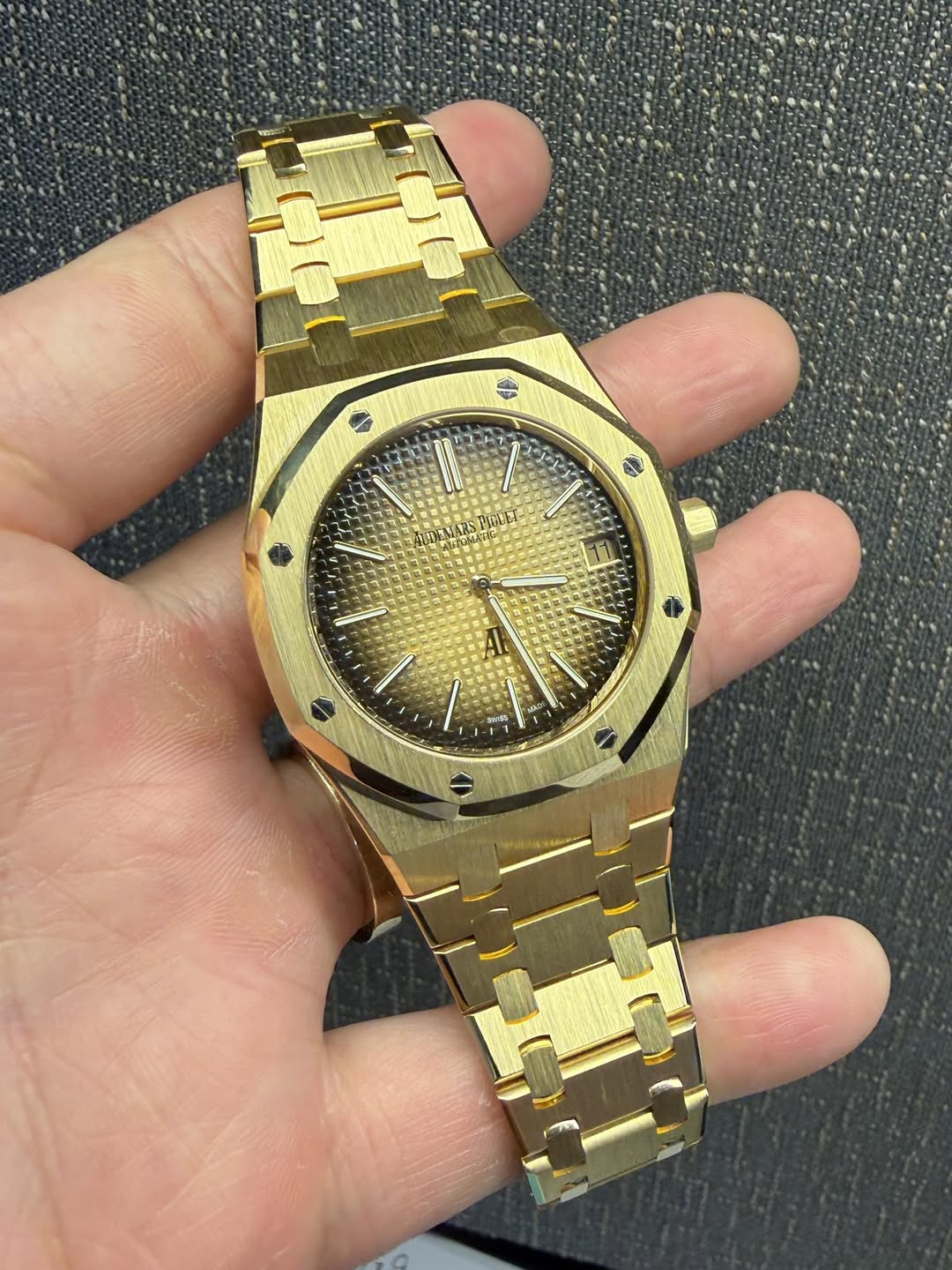 May be an image of wrist watch and text