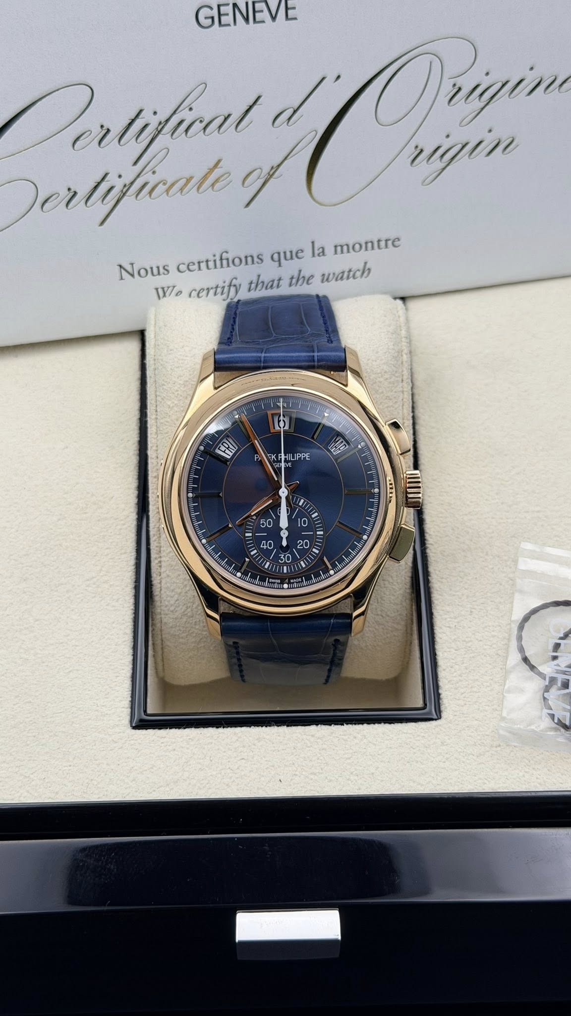 May be an image of wrist watch and text that says 'GENEVE Derlificate Dertifical Oiain Orizin rigin Nous certifions que la montre 1V certify that the watch 6 EH IPPE'