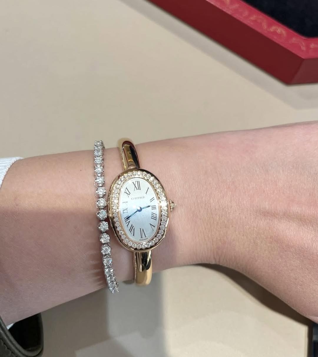May be an image of wrist watch, jewelry and text